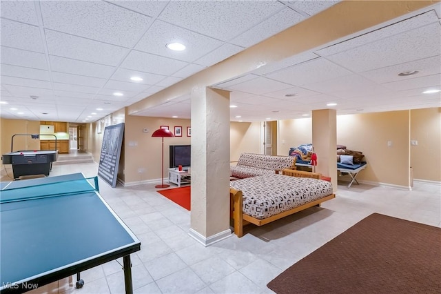 game room featuring recessed lighting, a paneled ceiling, and baseboards