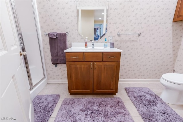 full bath with vanity, baseboards, wallpapered walls, tile patterned flooring, and toilet