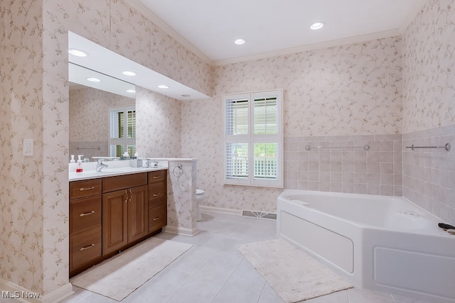 bathroom featuring a garden tub, toilet, wallpapered walls, tile patterned flooring, and baseboards