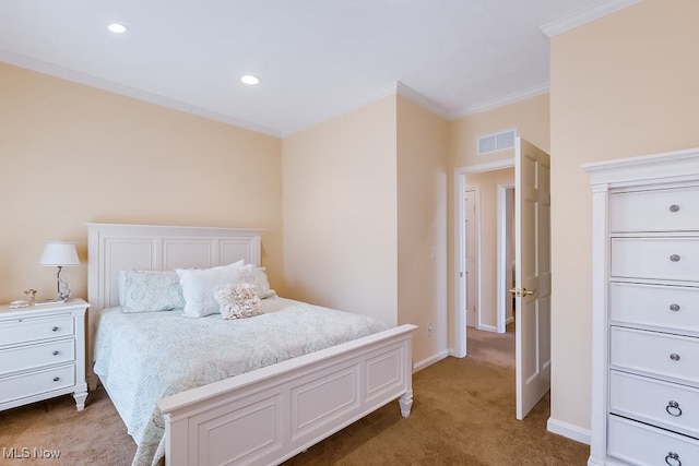 carpeted bedroom with visible vents, recessed lighting, baseboards, and ornamental molding