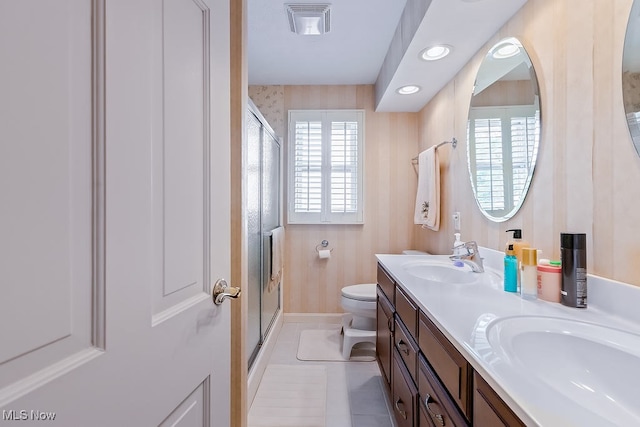 full bath with visible vents, a stall shower, a sink, tile patterned flooring, and toilet