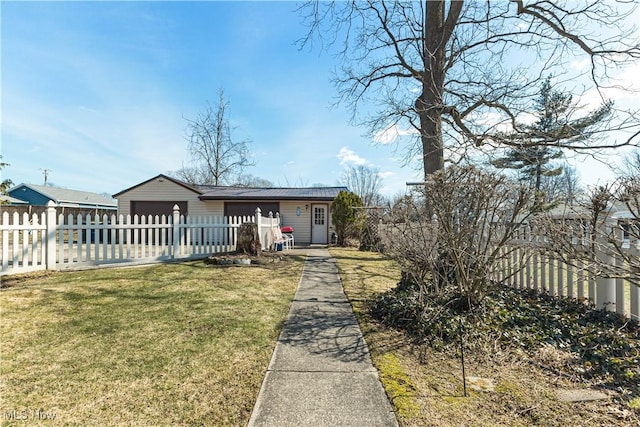 view of front facade with a fenced front yard and a front yard