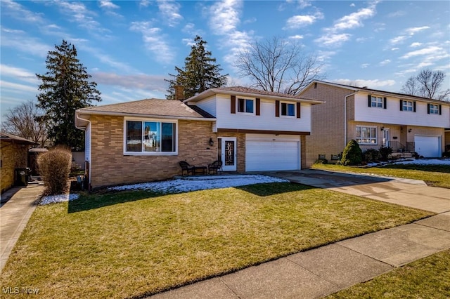 split level home with brick siding, driveway, an attached garage, and a front lawn