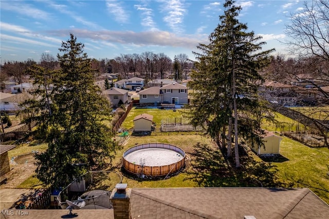 birds eye view of property with a residential view