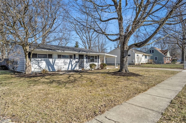 ranch-style house featuring a front lawn, a porch, and fence