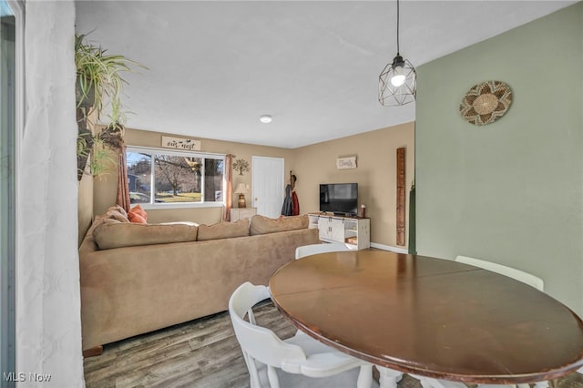 dining room with wood finished floors