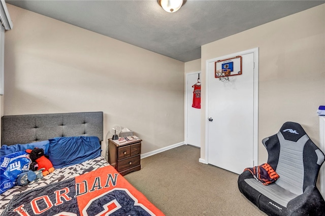 carpeted bedroom with baseboards