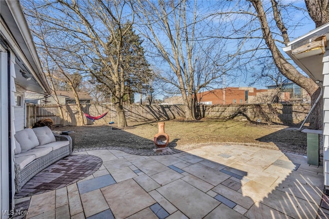 view of patio / terrace featuring an outdoor hangout area and a fenced backyard