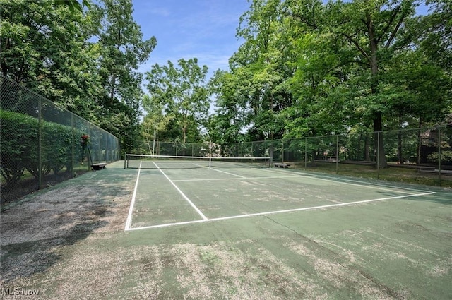 view of sport court with fence