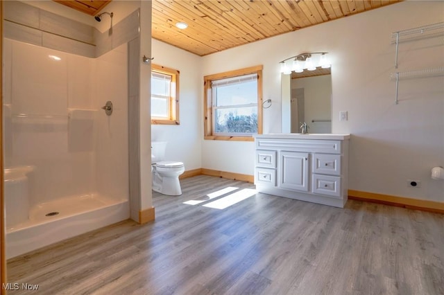 bathroom featuring wood finished floors, baseboards, wood ceiling, walk in shower, and toilet