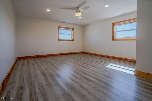 unfurnished room featuring recessed lighting, ceiling fan, baseboards, and wood finished floors