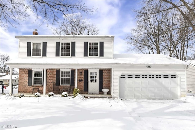 traditional-style home with brick siding and an attached garage