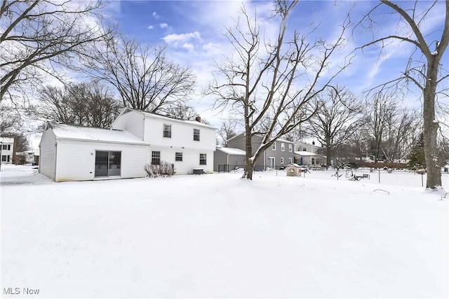 view of snow covered house