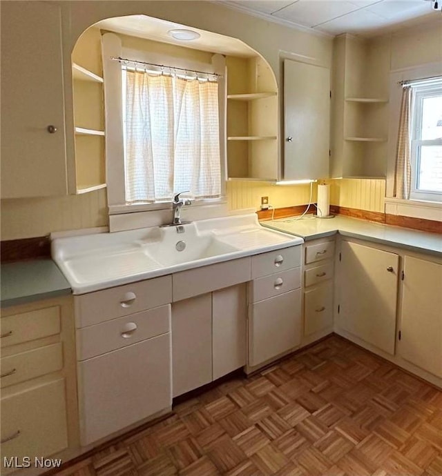 kitchen with light countertops and open shelves