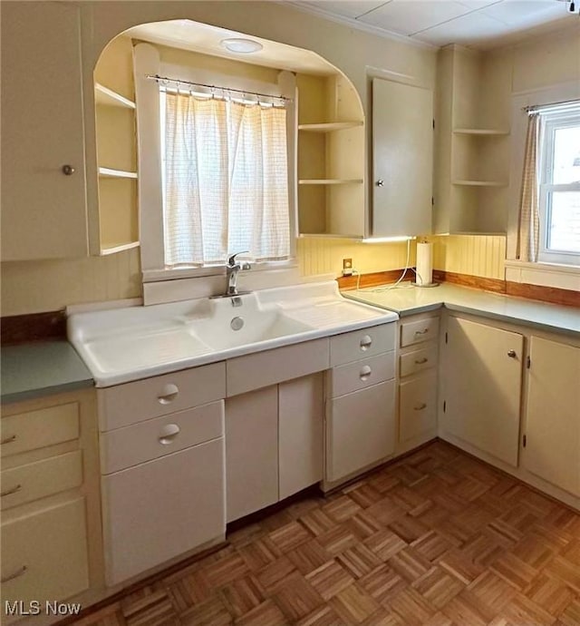 kitchen with light countertops and open shelves