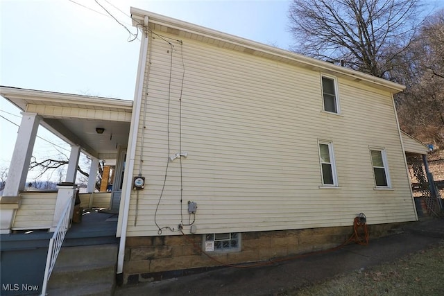 view of property exterior featuring a porch