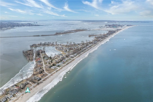 drone / aerial view featuring a view of the beach and a water view