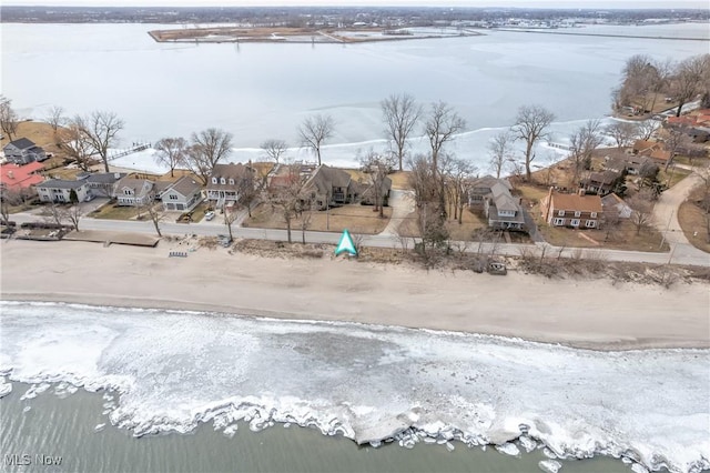 drone / aerial view with a residential view and a water view