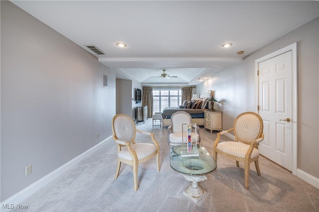 living area featuring visible vents, carpet, baseboards, a tray ceiling, and recessed lighting