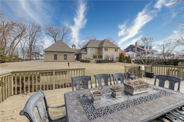 deck with outdoor dining area