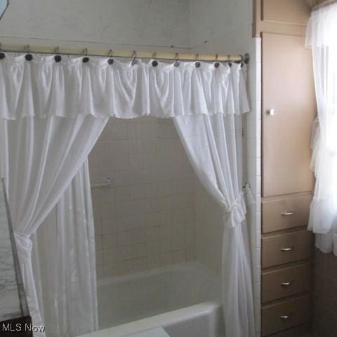 full bathroom featuring shower / bath combo