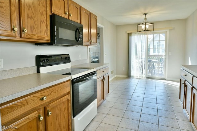 kitchen featuring white range with electric cooktop, brown cabinetry, light countertops, light tile patterned floors, and black microwave