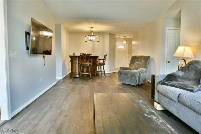 living area featuring wood finished floors and baseboards