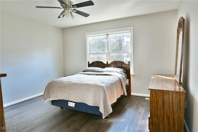 bedroom featuring a ceiling fan, dark wood-type flooring, and baseboards