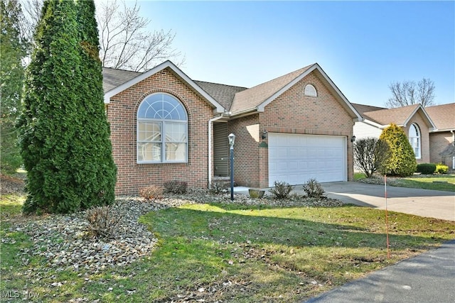 view of front facade with a front lawn, concrete driveway, a shingled roof, a garage, and brick siding