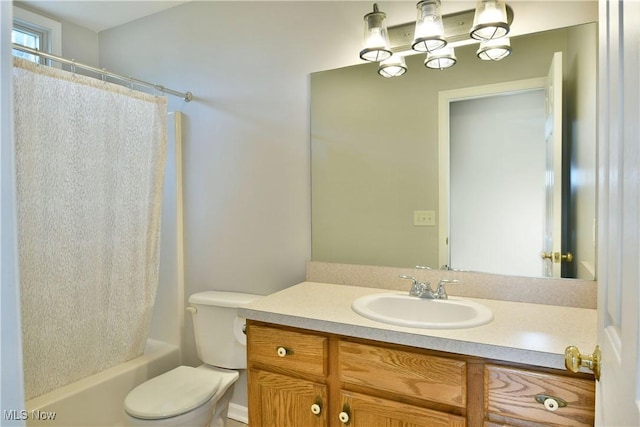 bathroom featuring shower / tub combo, toilet, and vanity