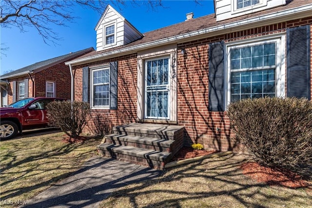 exterior space featuring brick siding