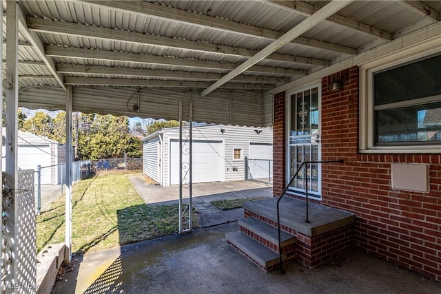 view of patio / terrace featuring an outbuilding and fence