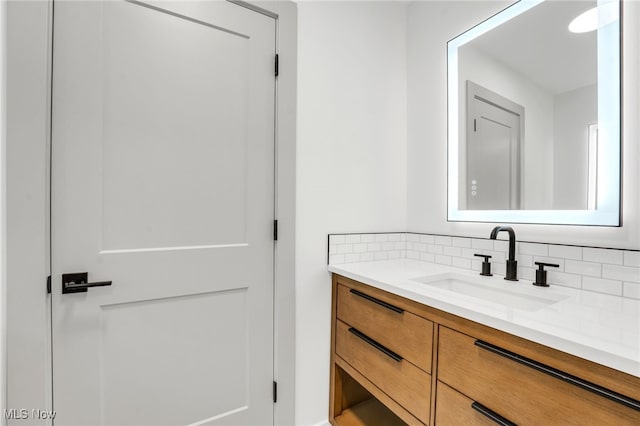 bathroom with backsplash and vanity