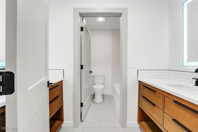 full bath with tile patterned floors, toilet, backsplash, a bath, and vanity