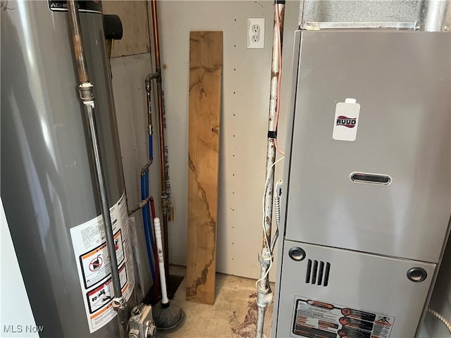 utility room with heating unit and water heater