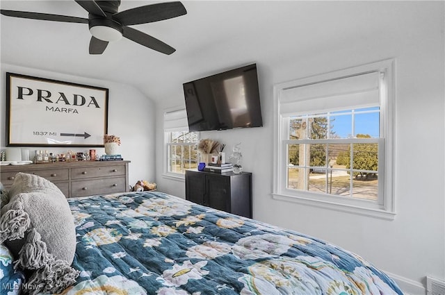 bedroom with visible vents, a ceiling fan, and vaulted ceiling