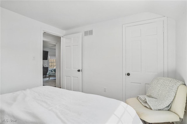 bedroom featuring visible vents