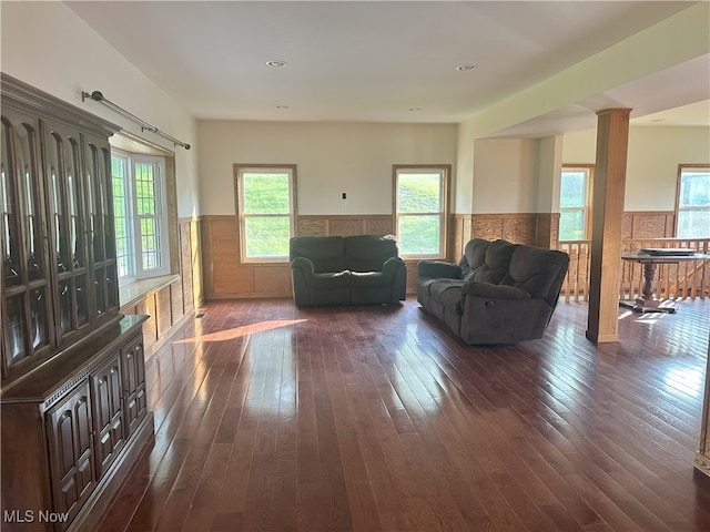 17583 Davis Ridge Rd, Caldwell, OH 43724 - living room featuring a wainscoted wall and dark wood-type flooring