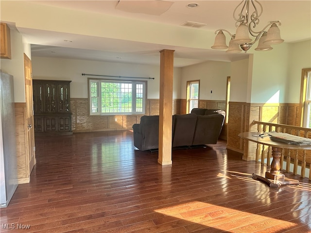 17583 Davis Ridge Rd, Caldwell, OH 43724 - living room with a wainscoted wall, wood finished floors, and a chandelier