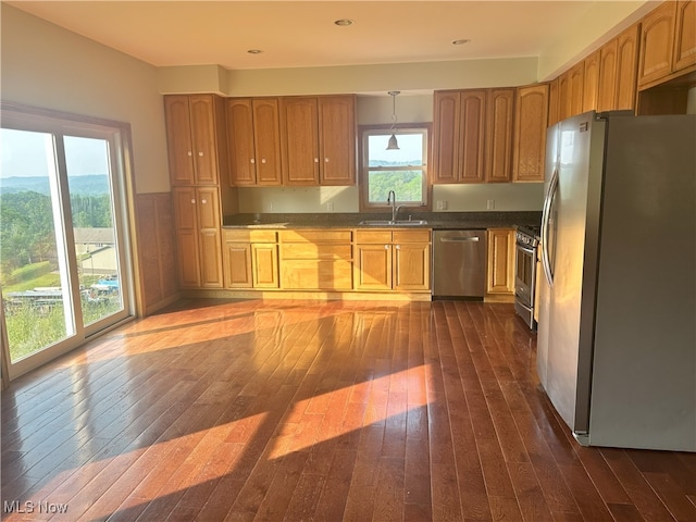 17583 Davis Ridge Rd, Caldwell, OH 43724 - kitchen with stainless steel appliances, a sink, dark wood finished floors, recessed lighting, and wainscoting