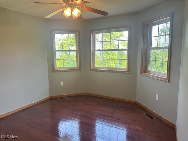 17583 Davis Ridge Rd, Caldwell, OH 43724 - empty room featuring dark wood-type flooring, baseboards, and a ceiling fan