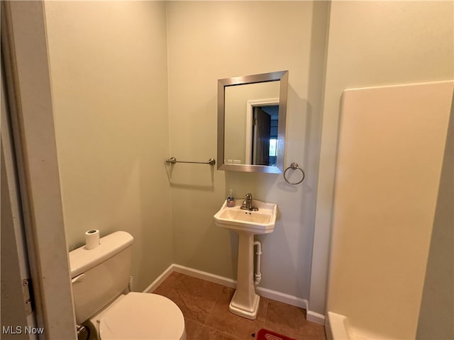 17583 Davis Ridge Rd, Caldwell, OH 43724 - bathroom featuring toilet, tile patterned floors, and baseboards