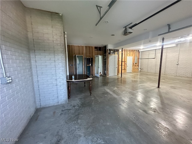 17583 Davis Ridge Rd, Caldwell, OH 43724 - below grade area with a garage and brick wall