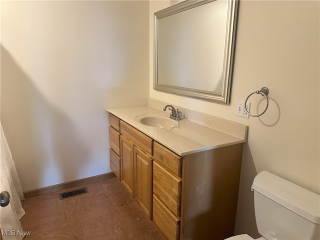 17583 Davis Ridge Rd, Caldwell, OH 43724 - bathroom with toilet, vanity, and baseboards