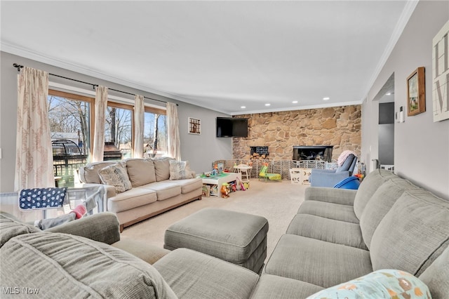 carpeted living area with recessed lighting, ornamental molding, and a fireplace