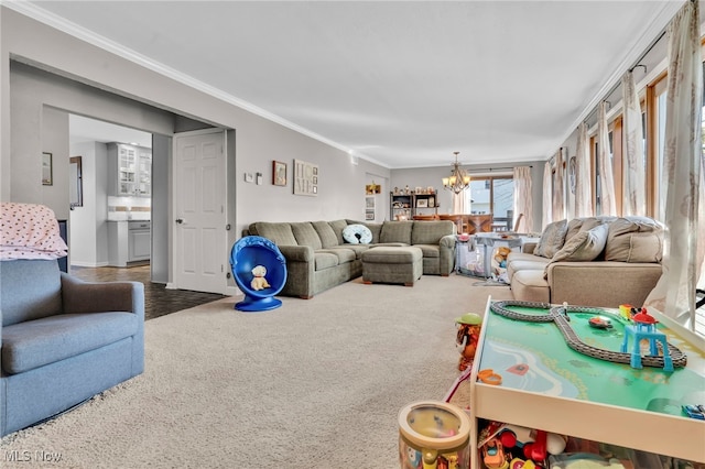 living area featuring ornamental molding, carpet, and a chandelier