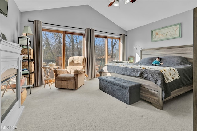 bedroom with a glass covered fireplace, carpet, ceiling fan, and access to outside