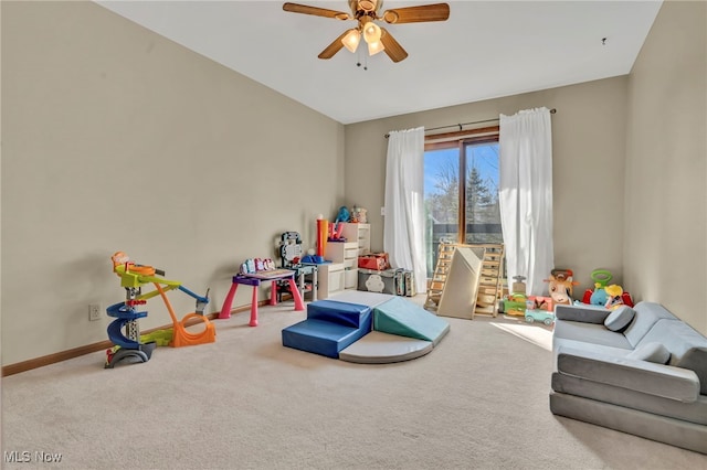 game room featuring a ceiling fan, carpet, and baseboards