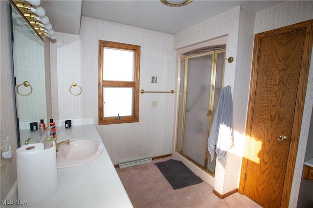 full bath featuring a shower stall, wallpapered walls, vanity, and baseboards