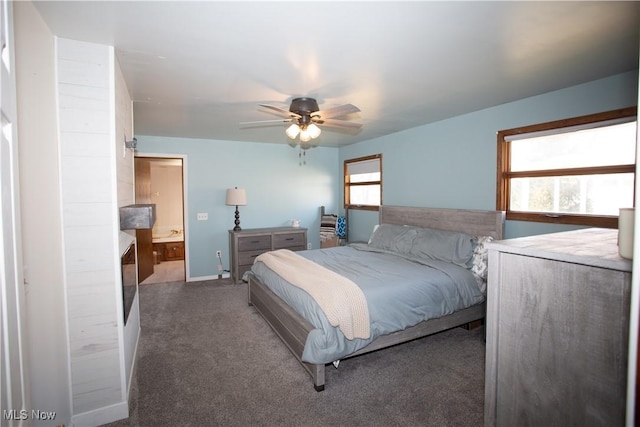 carpeted bedroom featuring a ceiling fan and ensuite bathroom